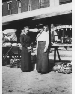 1914 Corn Carnival  Vegetable displays on Main Street. In background is the Robinson & Baker Clothing Store.